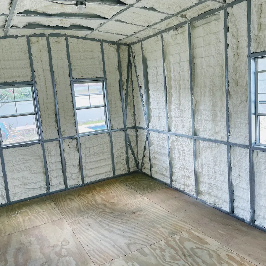 Closed-cell spray foam insulation applied to wall cavities in a residential project in Hartford City